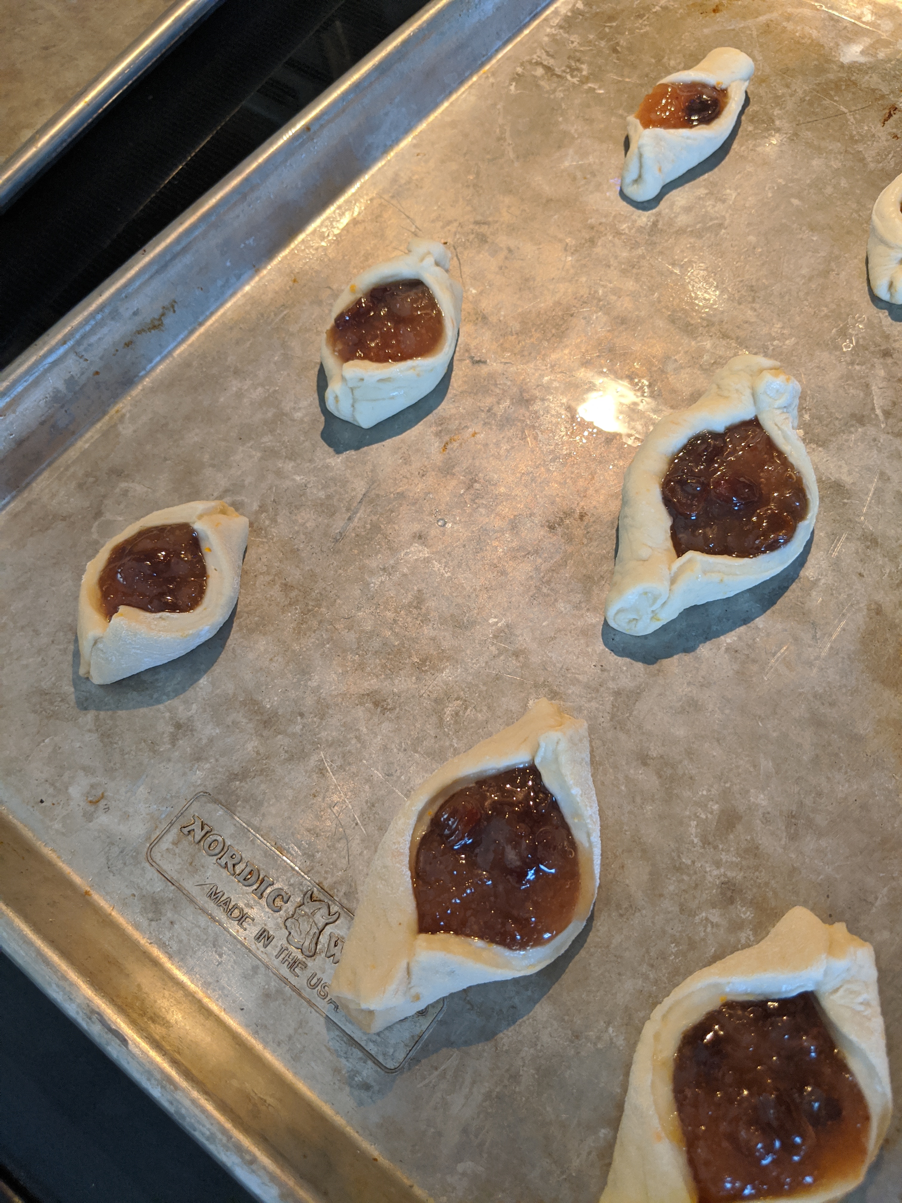 Some uncooked Hamantaschen waiting for the heat of the oven