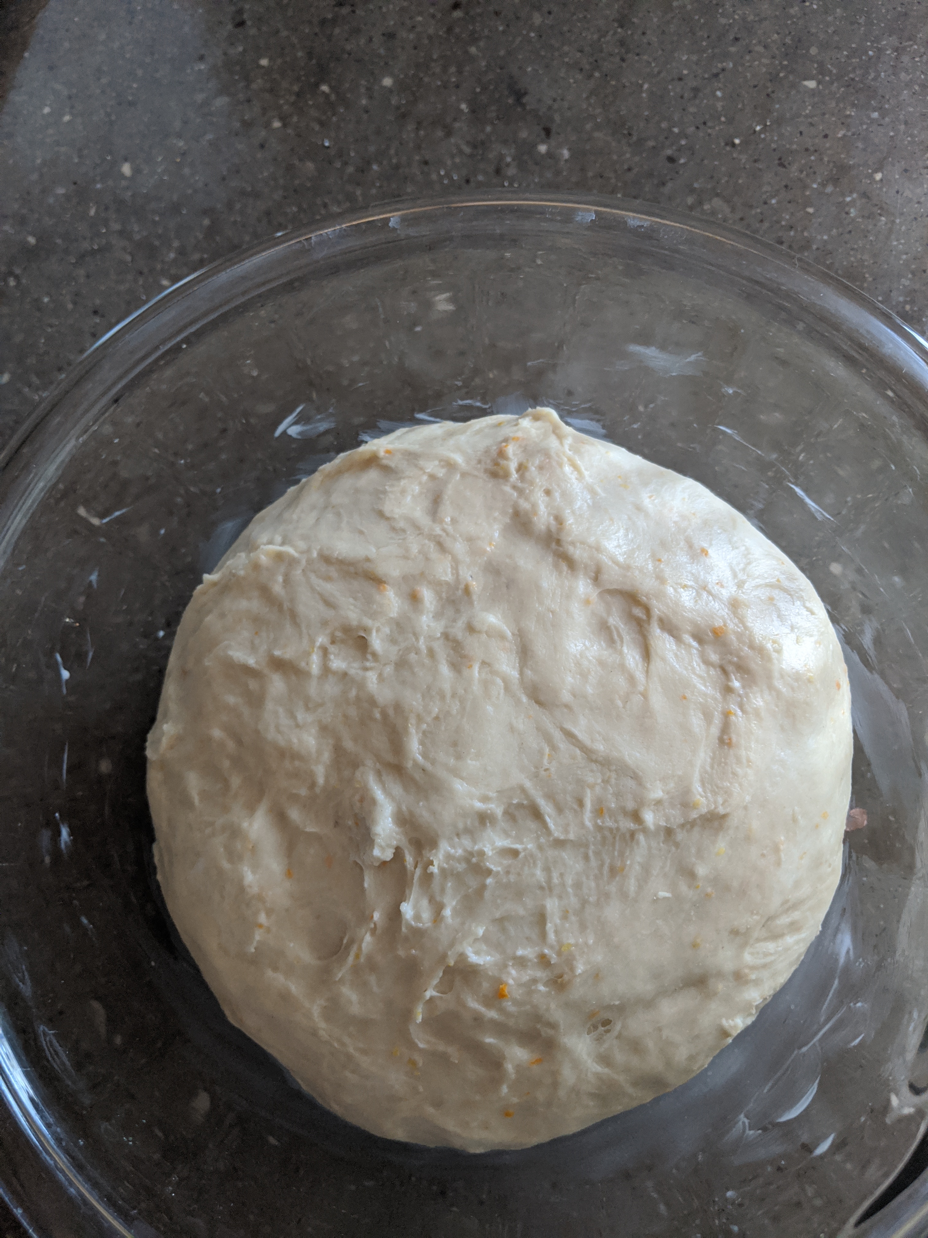A large bowl of uncooked, unrisen dough